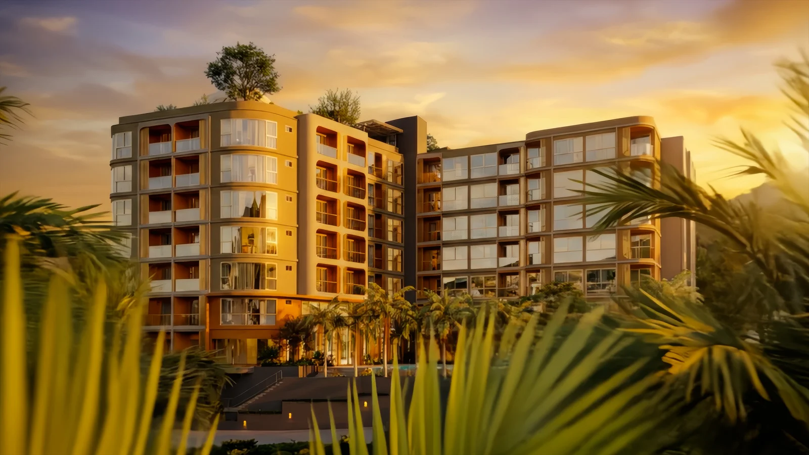 Facade at sunset seen through palm fronds